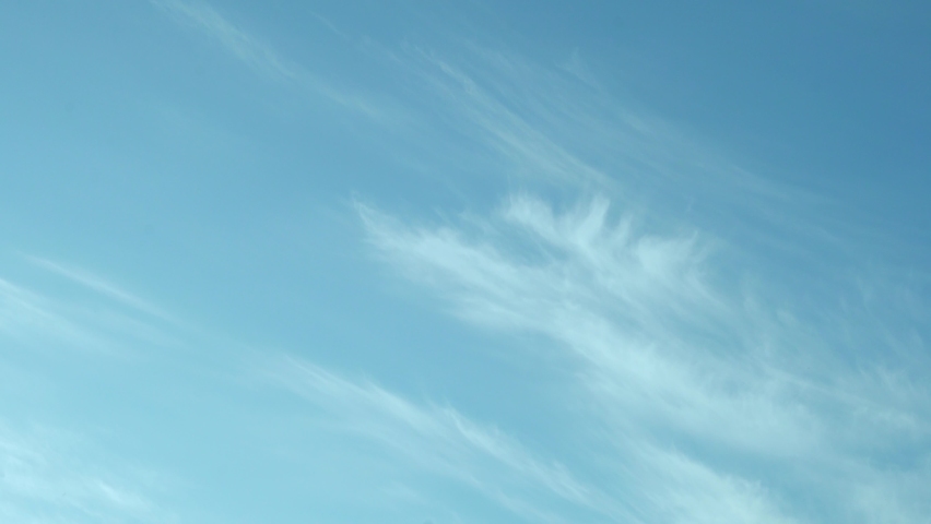 Azure Sky, Clear Blue Sky with Light Cirrus Clouds, Slow Motion, Time Lapse. Azone Layer, Air, Airy, Relaxation, Beauty. Cirrus White Tender Clouds and Clear Azure Summer Skyscraper. Light White Cloud Royalty-Free Stock Footage #1089510595