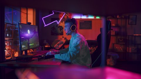 Professional eSports Gamer Plays 3D Shooter Video Game with Lots of Action and Fun on His Powerful Personal Computer at Home. Cyber Gaming Stylish Retro Neon Room. Real Gameplay.