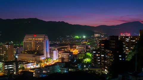 Nagasaki, Japan. A night timelapse made from a hill in Nagasaki, Japan, with over the entire center, including the hills. Time-lapse at night, zoom in