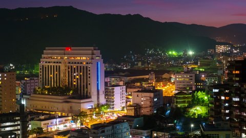 Nagasaki, Japan. A night timelapse made from a hill in Nagasaki, Japan, with over the entire center, including the hills. Time-lapse at night, panninmg video