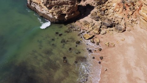 Drone Panning up to the cliffs, Marinha Beach, Algarve, Portugal