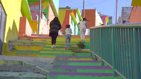 Mexican People in Colorful living district in Pachuca, Hidalgo state, Mexico. Colorful buildings in Cubitos colonia