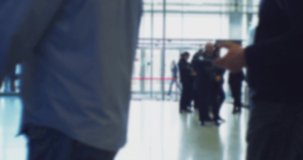 time lapse. modern business life. defocused blurry video. background on the theme of business. blurred silhouettes of unrecognizable people walking in a large hall.