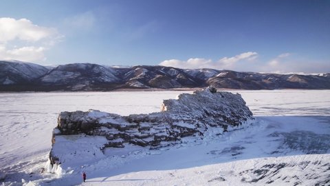 Rocky island on Lake Baikal in winter, drone shots