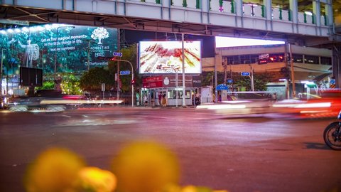 Bangkok , Thailand - 04 19 2022: Bangkok traffic at Busy Crossing Street View Night