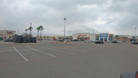 Pharr , Texas , United States - 02 15 2022: Driving through the parking lot at Sharyland Towne Crossing