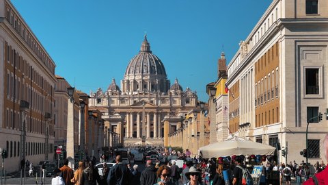 Vatican , Vatican City (Holy See) - 10 21 2021: Panorama shot showing many tourist visiting famous St. Peters Basilica And Square In Vatican City, Rome