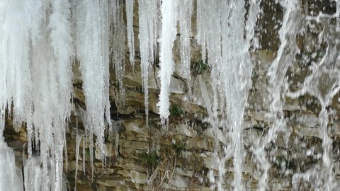 Waterfall and icicle on a stone surface in Niagara Escarpment in Hamilton