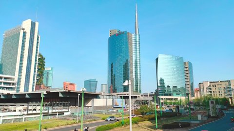 MILAN, ITALY - APRIL 15, 2022: Milan skyline with modern skyscrapers in Porta Nuova, Milano, Italy. 4k video time lapse.