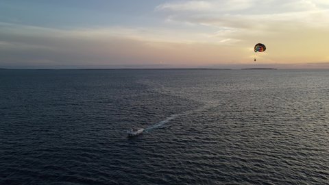parachuting at sunset on Zanzibar, water scooter on Nungwi beach parachuting tourists at sunset