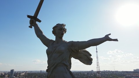 Close-up drone view of the epic famous Soviet sculpture The Motherland Calls. Historical memorial. The statue is an allegorical image of the Motherland - JULY 08, 2021 Volgograd, Russia