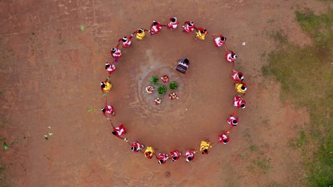 Arial shot of tribal group dancers creating a pattern