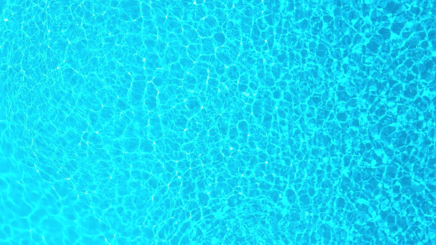 Blue water in the swimming pool with light reflections. Aerial footage | Shutterstock HD Video #1089546939