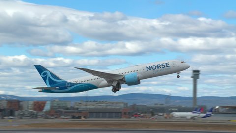 Oslo Airport Norway - April 23 2022: airplane boeing 787 dreamliner norse atlantic airways rondane take off slow motion