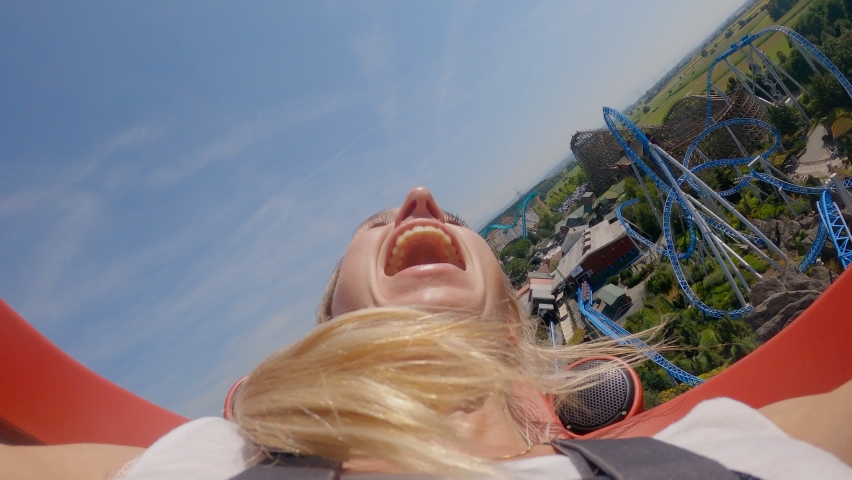 Point of view of woman riding roller coster. Female on a roller coster, close up face POV | Shutterstock HD Video #1089557323