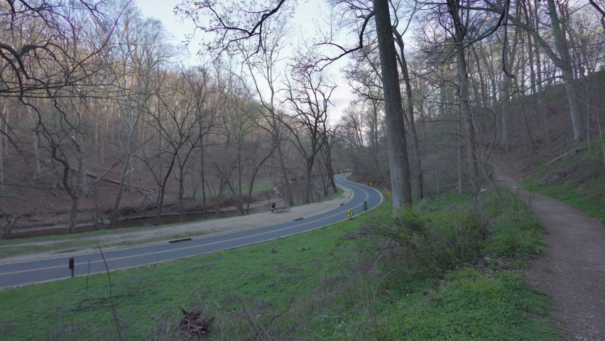 Bicyclists and runners ride and run on Beach Drive in Washington, D.C.