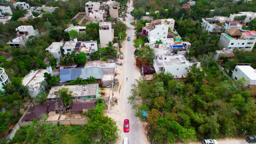 Aerial View Of Street In Small Tropical Town Of Tulum Mexico Lined With Hotels And Apartments.