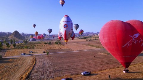 Cappadocia, Turkey – April 1, 2022: Aerial view of hot air balloons flying at sunrise, 4k