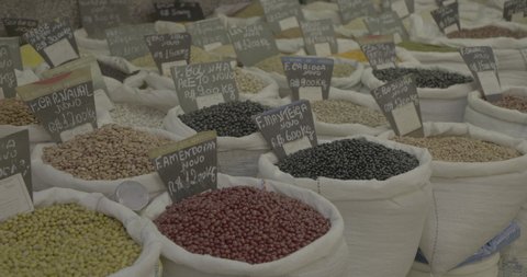 exhibition of bulk grains in a popular market in Brazil. colored grains on display.