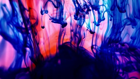 Color paint drops in water, abstract colour mix, drop of ink color mix paint falling on water Colorful paints splash swirling underwater. Overlay color effect.
