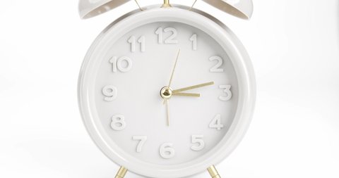 Close up Zoom in Vintage alarm clock over isolated on white background, Showtime 03.13 am or pm.