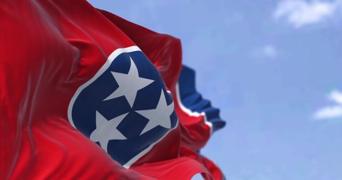 The US state flag of Tennessee waving in the wind. Tennessee is a state in the Southeastern region of the United States. Democracy and independence. Seamless loop in slow motion. 4K resolution