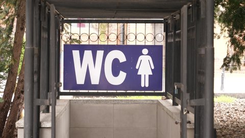 WC toilet sign over an entrance to female lavatory on a street of Wroclaw Poland