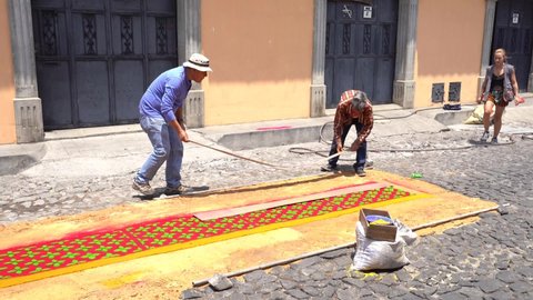 antigua guatemala , Guatemala - 04 14 2022: People making traditional sawdust rug in holy week 2022