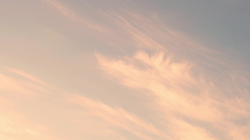 Tender Pink Peach Sky at Dawn with Feather Light Clouds, Slow Motion. Relaxation, Beauty, Summertime Pearly Beautiful Clear Skyscraper with Cirrus Clouds at Sunrise, Time Lapse. Royalty-Free Stock Footage #1089590713