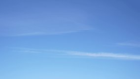 4k video time lapse of clear sunny blue sky. White soft small lines of soft clouds isolated on blue sky background. Natural abstarct video backdrop