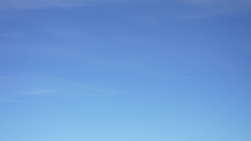 4k video time lapse of clear sunny blue sky. White soft small lines of soft clouds isolated on blue sky background. Natural abstarct video backdrop