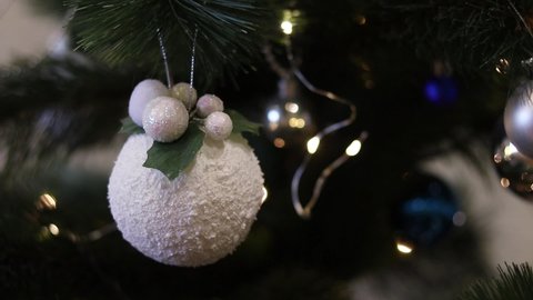 Christmas background. Christmas tree and white christmas ball.