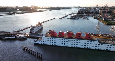 Amsterdam, The Netherlands - April 2022 : Aerial view of one of Europe's biggest tourist destinations as it recovers from the economic burden of the Covid-19 pandemic - The Botel tourist hotel 