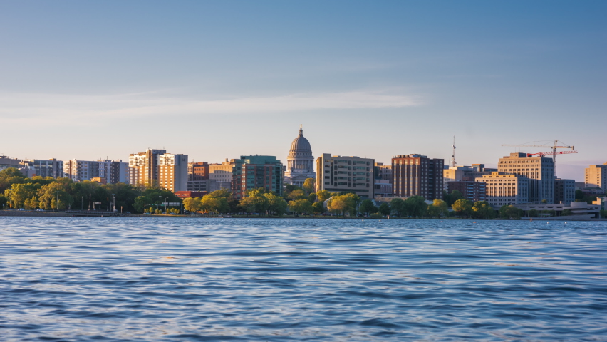 Madison, Wisconsin, USA downtown skyline at dusk on Lake Monona.