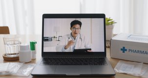 Video call screen of asia male doctor in teleconsult telehealth telemedicine app medtech platform chat advice first aid kit pill drug to sick patient at home. Help guide live talk in smart clinic.