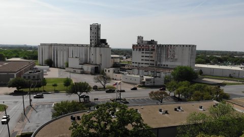 ril 16, 2022: Aerial view of abandoned warehouse outside of downtown Fort Worth.