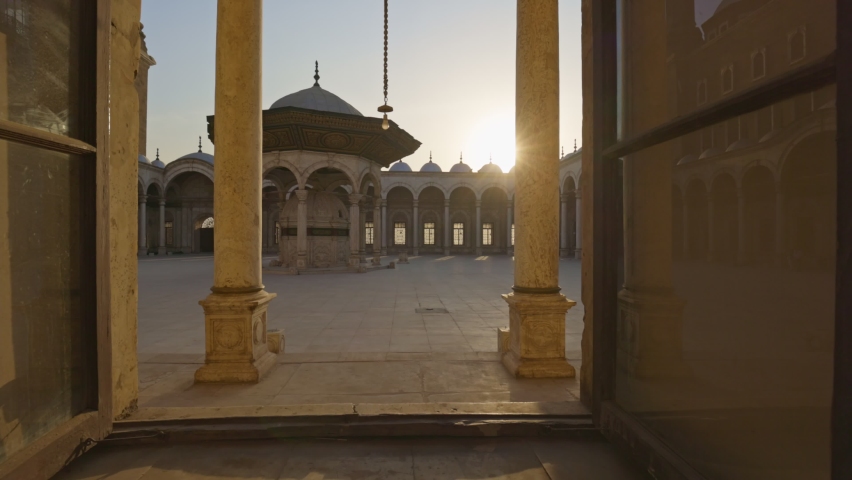 Sun breaks through the lattice of window in the mosque Muhammad Ali Pasha, courtyard is visible inside. Great Mosque of Muhammad Ali Pasha or Alabaster Mosque in Cairo, Egypt. Citadel of Cairo. Gimbal