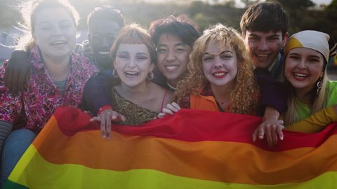 Diverse young friends celebrating gay pride festival - LGBTQ community concept 