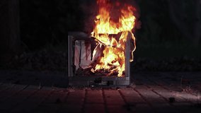 Burning fire in an old broken TV set, toxic air pollution from burning plastics melting and dripping down. Old CRT screen - Powered by Shutterstock - Get 15% off with code: PIKWIZARD15