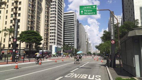 SAO PAULO, BRAZIL - MARCH 2022: Avenida Paulista, also known as the Paulista Avenue, one of the longest and busiest streets in Sao Paulo. It is traffic free pedestrian zone every Sunday.
