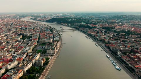 Establishing Aerial view of Budapest Cityscape - Hungary Capital Skyline at daytime with Hungarian Parliament and Danube river. Travel and Tourism in Europe. 4K zoom in panoramic shot