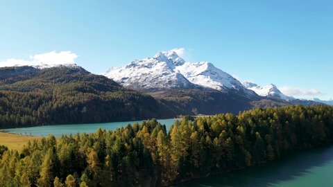 Aerial View Of Lake Surrounded By Trees In Autumn Colors - Engadin, Switzerland, Swiss Alps