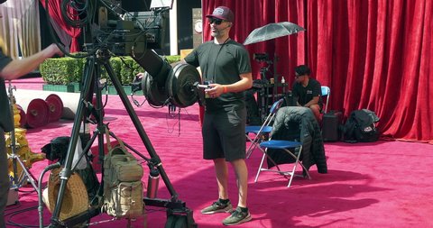 LOS ANGELES, CALIFORNIA, USA - MARCH 26, 2022: Media broadcast crew preparation for Red Carpet Oscar academy award nomination coverage in Los Angeles, California, 4K