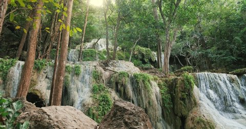 Waterfall clear emerald water for holiday relax travel in green jungle or forest at Erawan Waterfall, Erawan National Park in Kanchanaburi, Thailand