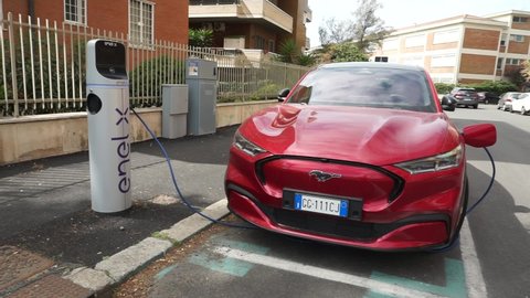 Rome, Italy - April 25, 2022, detail of an electric Ford Mustang car, parked for recharging.