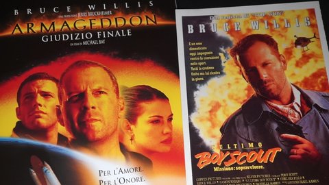Rome, Italy - April 01, 2021, detail of the cover of the film Armageddon - Final Judgment and the postcard of the movie poster of the film The last boy scout, Mission to survive.