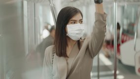 An young woman is wearing protective mask in metro , covid-19 protection ,  safety transportation , travel under pandemic concept . - Powered by Shutterstock - Get 15% off with code: PIKWIZARD15