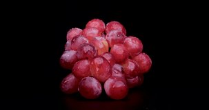 4K Video of red grapes on a turntable against a black background.
Grapes called 