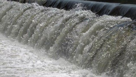 Weir of a hydroelectric power plant in slow motion