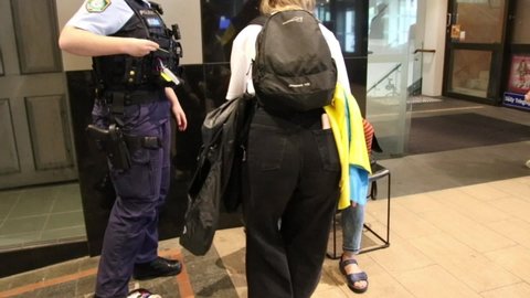 Sydney, NSW, Australia - April 22nd 2022: A woman has been treated for a cut to the head after being struck by a flying projectile outside a Ukrainian protest at the German Consulate.
